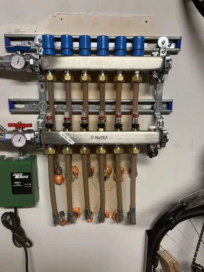 Plumber performing Water Heater Repair at a residential property in Olive Branch